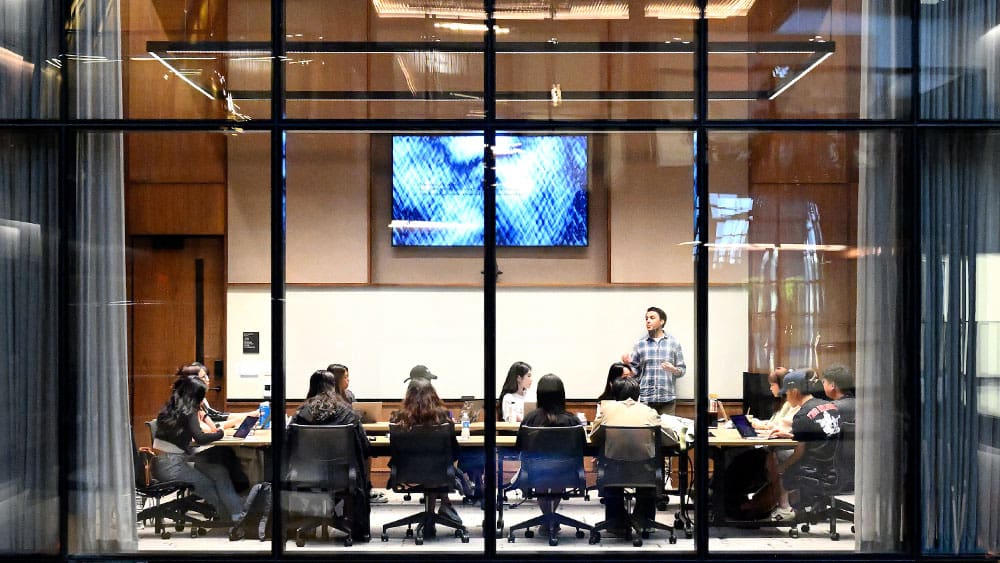 A view of the class in session through the exterior pane glass.