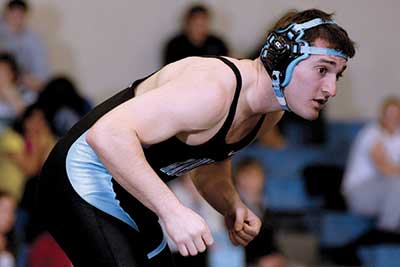 Eric Fishel in wrestling stance in preparation for a match