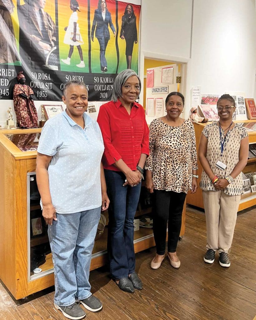 four women standing together in the Metropolitan United Methodist Church's museum