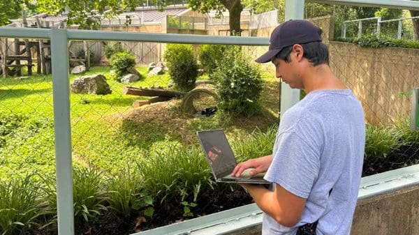 Junior Alex Jeffords interned with the Smithsonian’s National Zoo primate department in Washington, D.C., Here, he observes primates outdoors in their enclosure and takes notes on their interactions and behaviors.