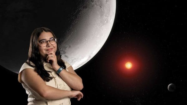 Junellie Perez looks up against a background showing an artist’s concept of the hot rocky exoplanet TRAPPIST-1.