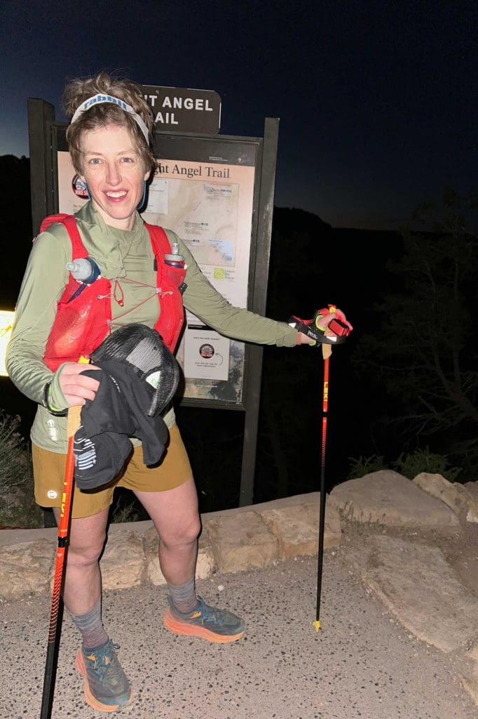 Emily Riehl in front of a trail sign.