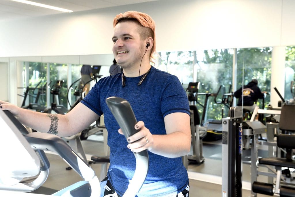 Person on elliptical machine in the Rec Center