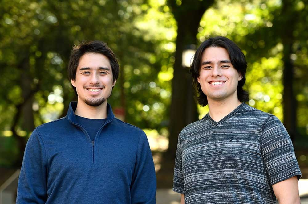 Thomas (at right, grey t-shirt) and Curtis Nishimoto
