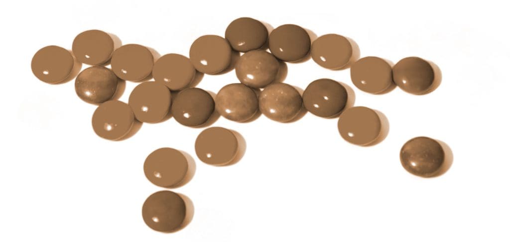monochromatic M&Ms on white background