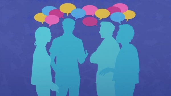 Illustration of four figures talking in a group, there are multicolored speech bubbles above their heads.