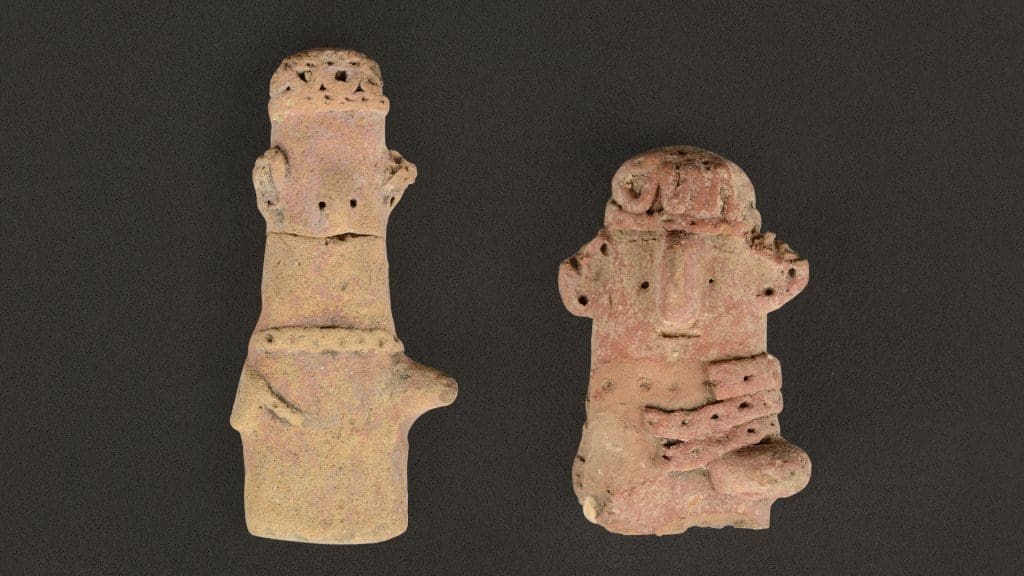 Two cypriot plank figurines that look like Bert and Ernie.