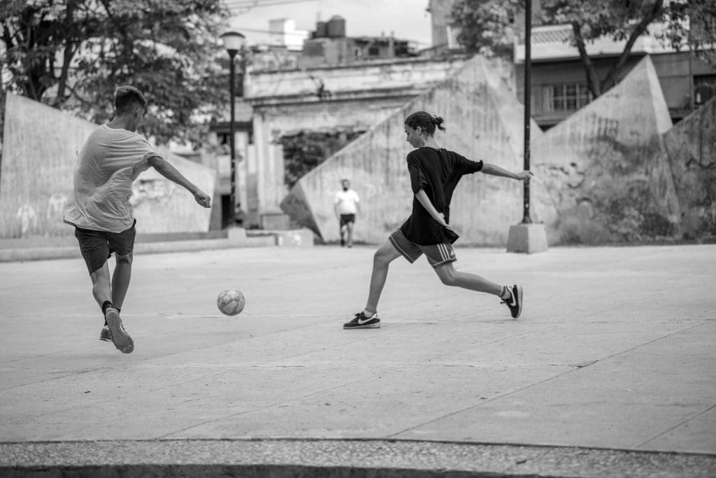 Students play soccer at the Parque de los Mártires Universitarios (Park of the University Martyrs) in Havana, Cuba, 2022.