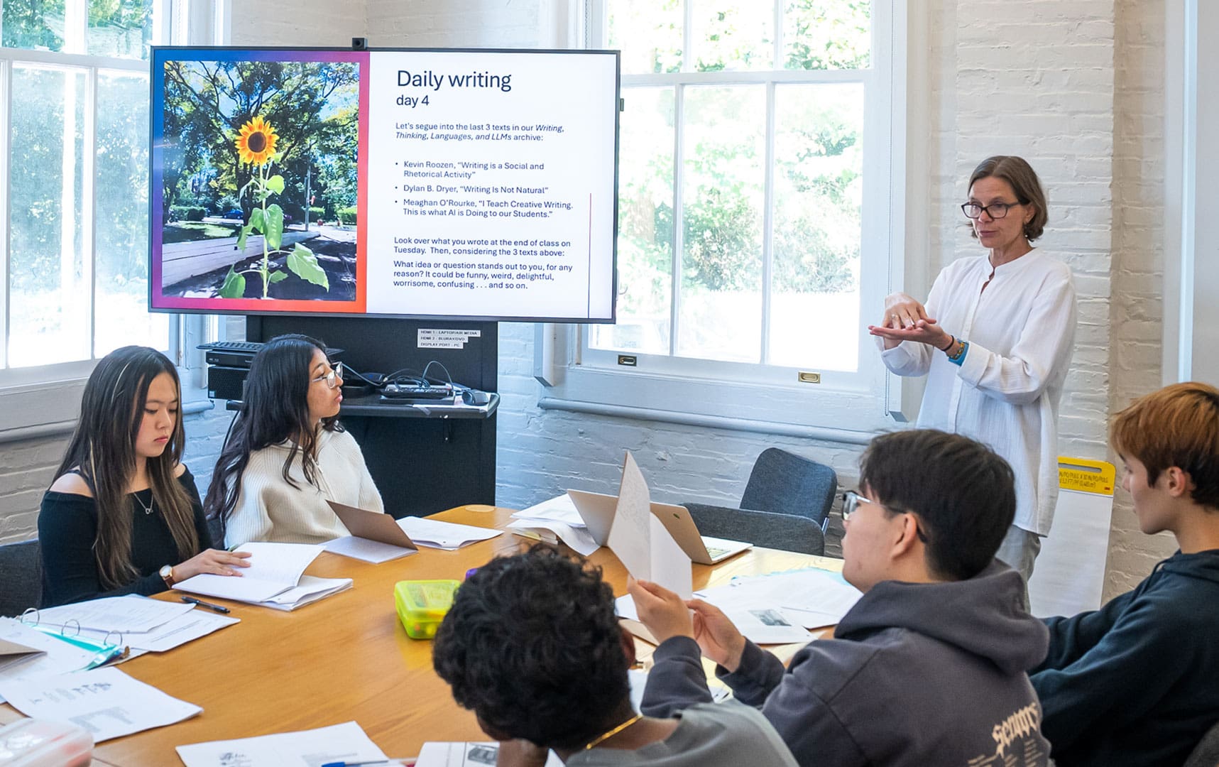 Anne-Elizabeth Brodsky leads students through their daily writing assignment in her Reintro class. 
